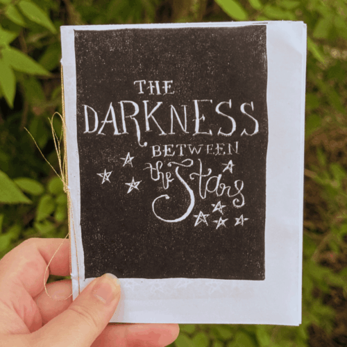 the darkness between the stars zine front cover
